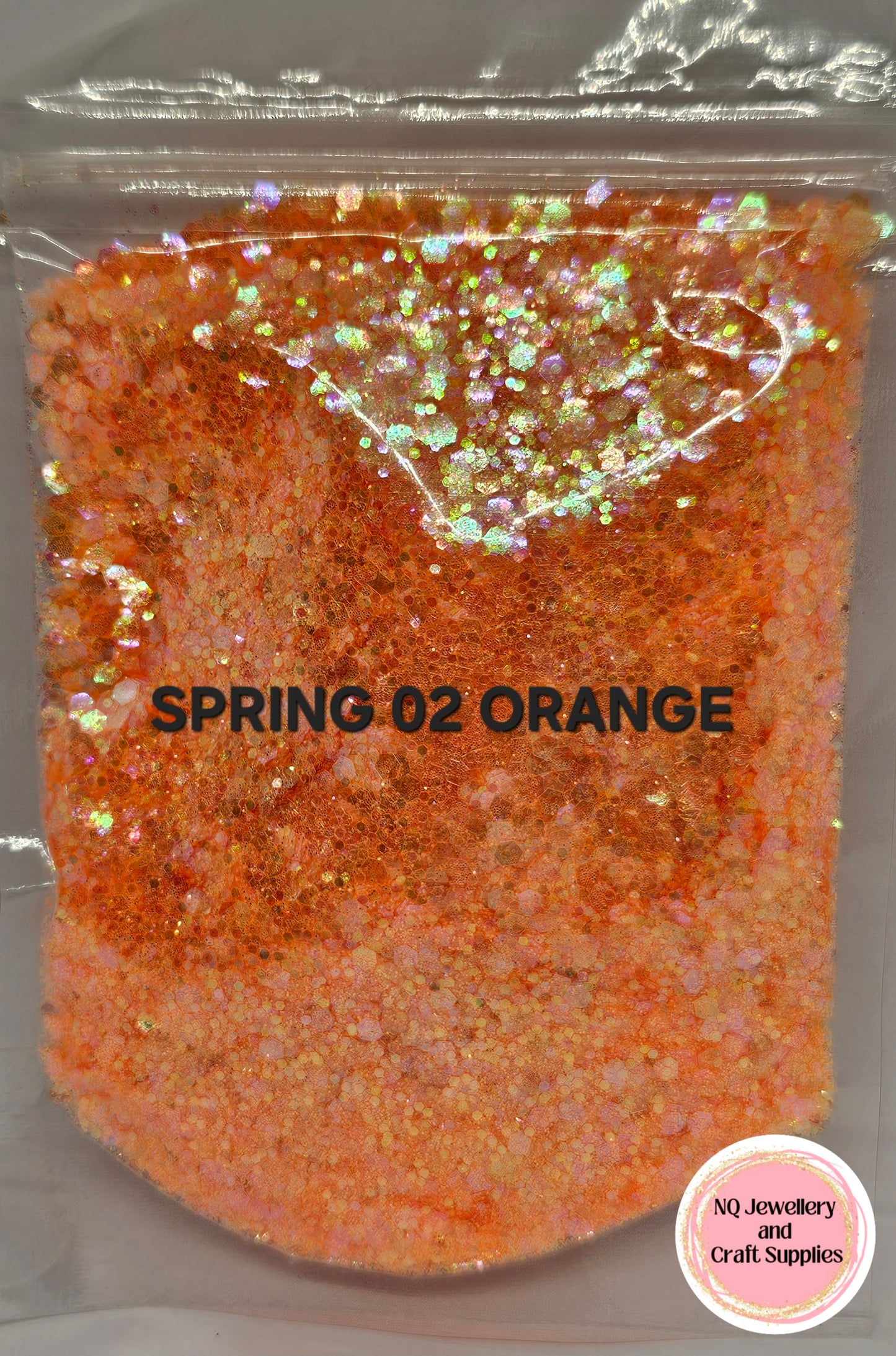 Orange glittery powder in a clear plastic bag with 'SPRING 02 ORANGE' text and NQ Jewelry & Craft Supplies logo.